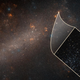 The Large Magellanic Cloud with a Hubble close-up inset.